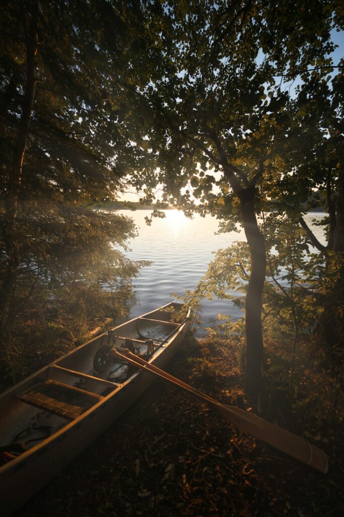 Canoe on a shoreline at sunset